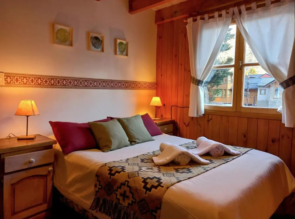 Cabañas Aitue dormitorio cama dobke