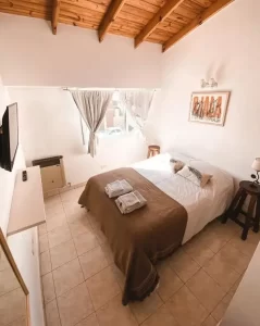 Hostel Chepatagonia cama doble con toallas