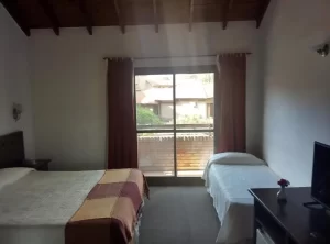 Hotel Spa Villa Merlo cama doble junto a cama individual