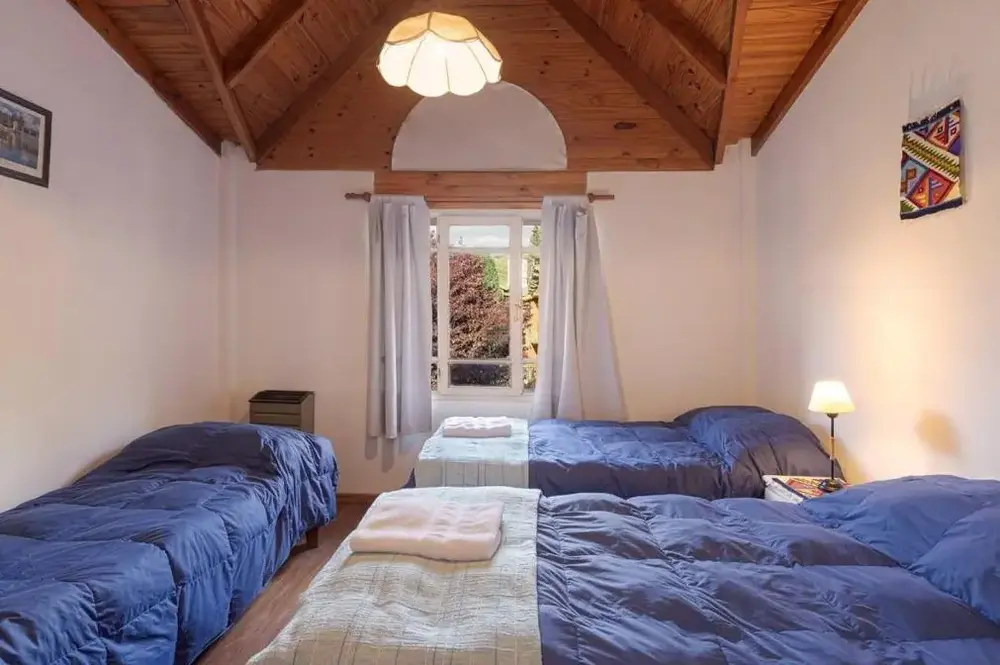 Cabañas del Lácar camas individuales con toallas