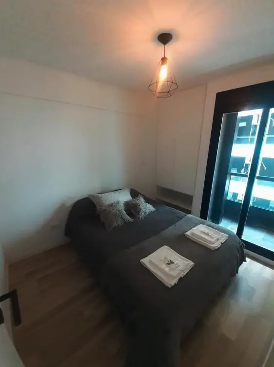 Departamentos Celenia Suites cama doble con toallas