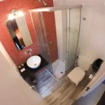 Hostel Malevo Muraña baño completo