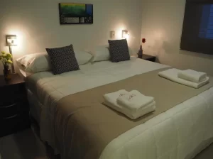 Aparthotel Umbral del Aconcagua cama doble con toallas