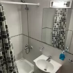 Departamentos Alem 25 espejo del baño