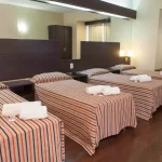 Hotel Hathor camas individuales con toallas