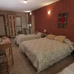 Hotel Xumec cama doble y camas individuales