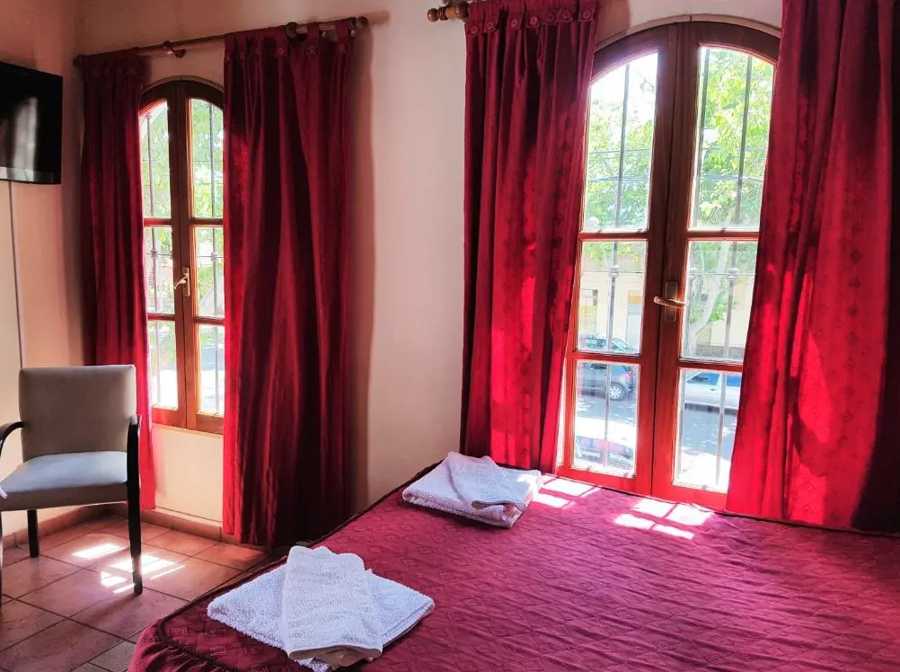 Departamentos Azul cama doble con toallas