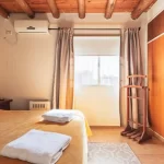 Departamentos Complejo Abaurrea cama doble con toallas