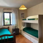 Hostel Open House cama individual y cucheta