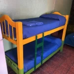 Hostel Ruca Potu cucheta con toallas